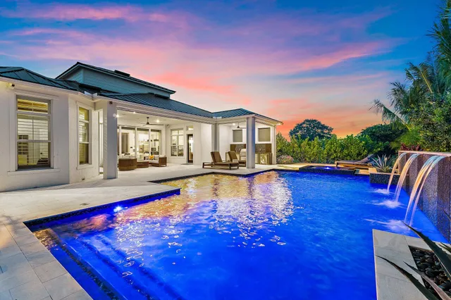 a view of swimming pool with outdoor seating and wooden floor