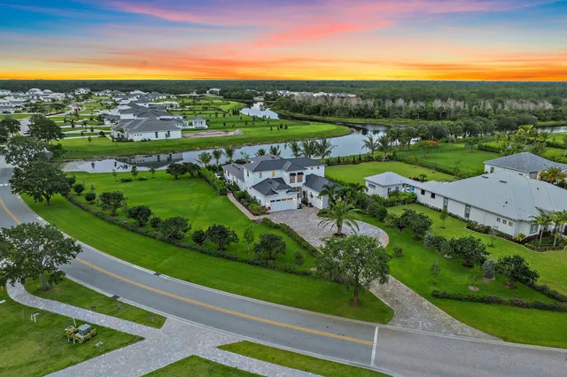 an aerial view of a house with a swimming pool