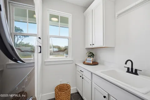 a kitchen with a sink and a window