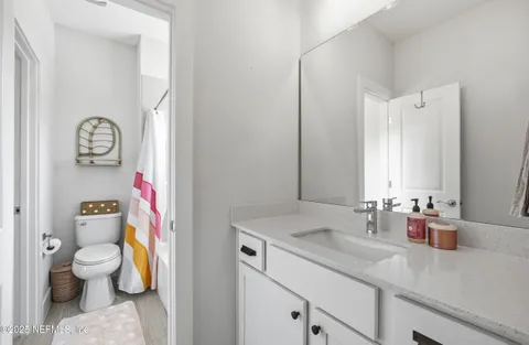 a bathroom with a tub and shower