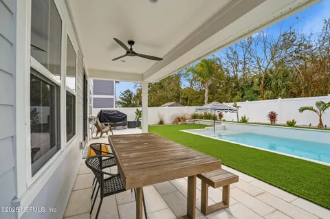 a view of a swimming pool with a yard