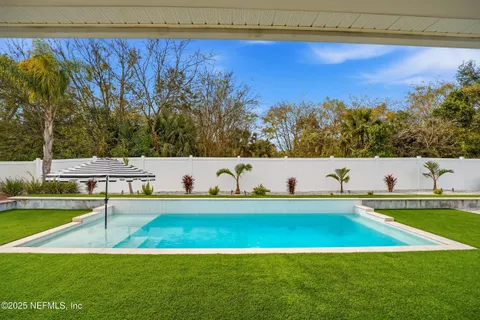 a view of a patio with swimming pool