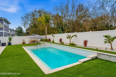 a view of a lake with outdoor seating