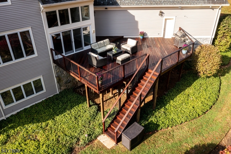 2 Cobblefield Road Mendham, NJ 07945 - Photo 42 of 50 a backyard of a house with table and chairs