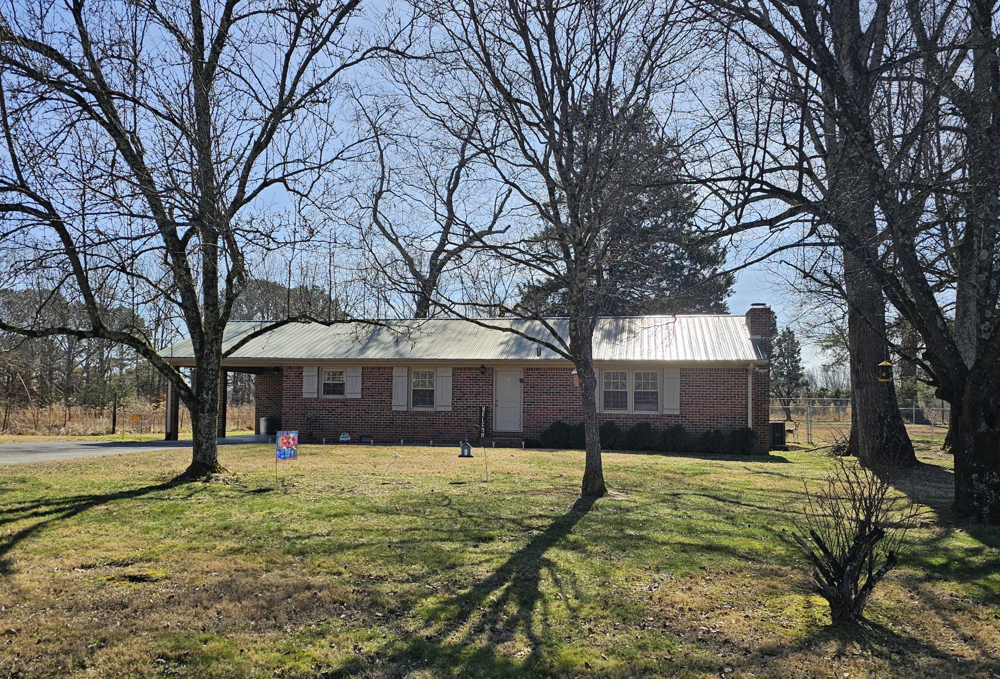 759 Little Hurricane Road Winchester, TN 37398 - Photo 1 of 30 a view of a white house with a yard covered with snow in front of house