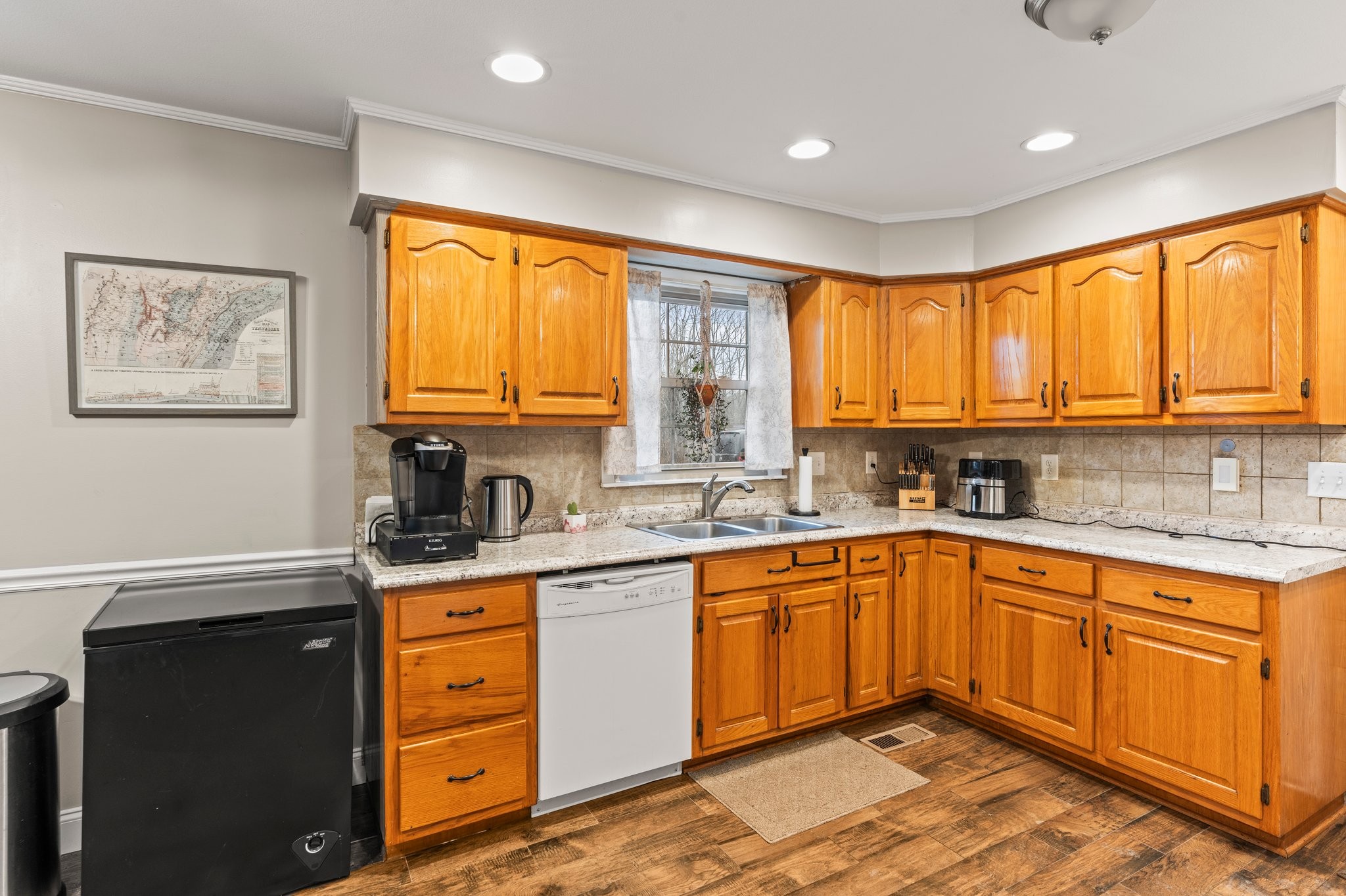 759 Little Hurricane Road Winchester, TN 37398 - Photo 12 of 30 a kitchen with stainless steel appliances granite countertop wooden cabinets a sink and a window
