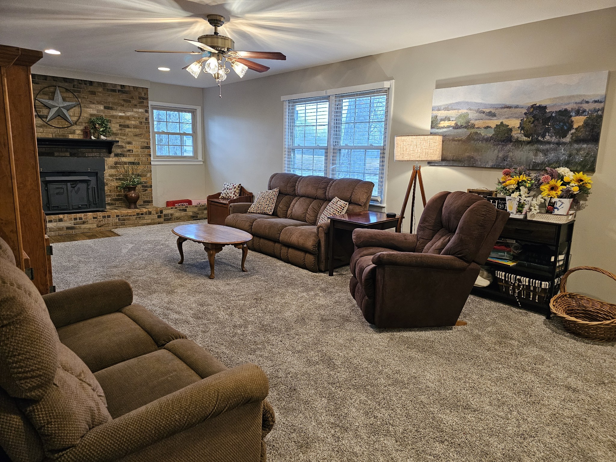 759 Little Hurricane Road Winchester, TN 37398 - Photo 4 of 30 a living room with furniture a fireplace and a chandelier