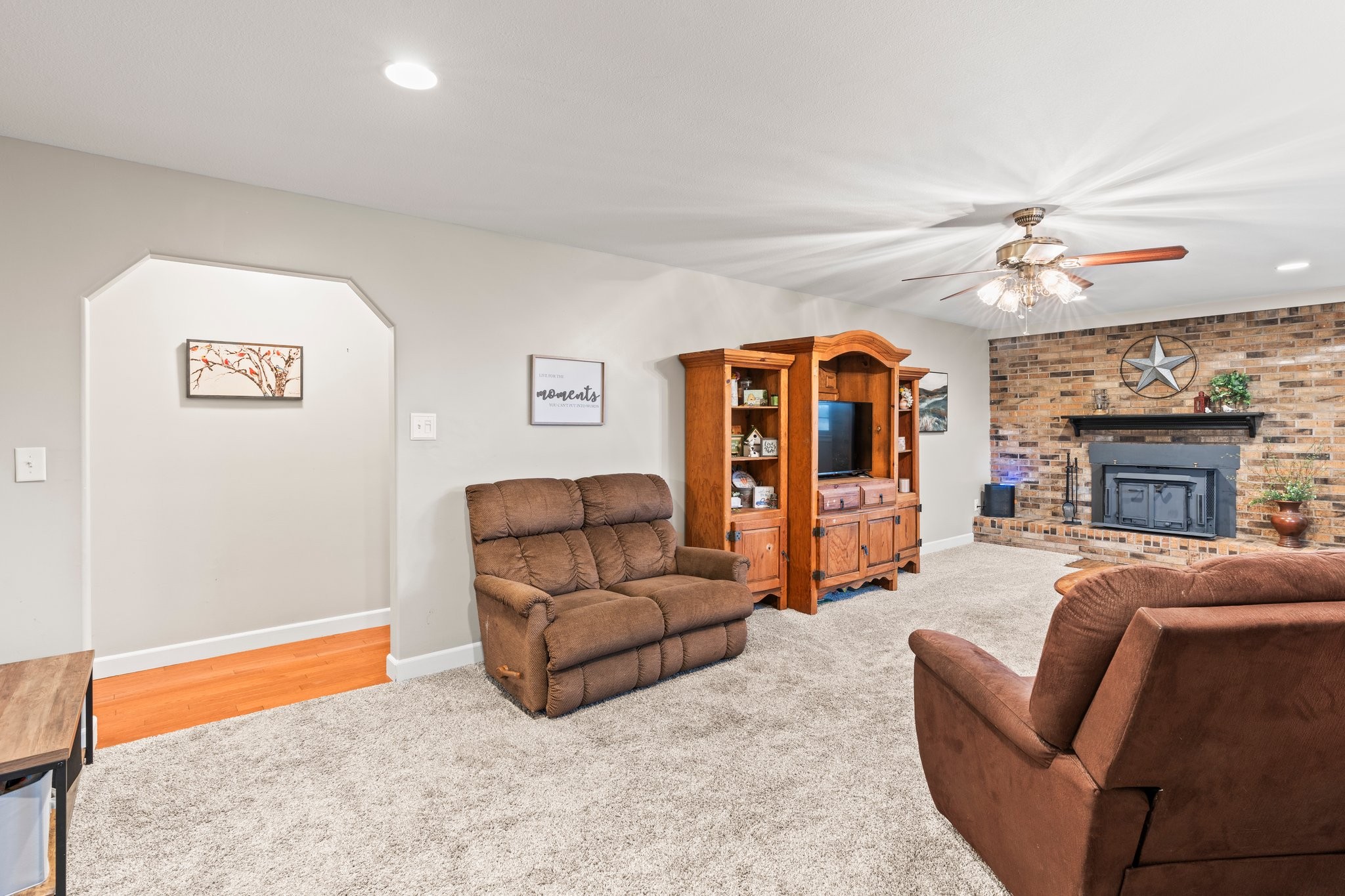 759 Little Hurricane Road Winchester, TN 37398 - Photo 6 of 30 a living room with furniture a fireplace and a flat screen tv