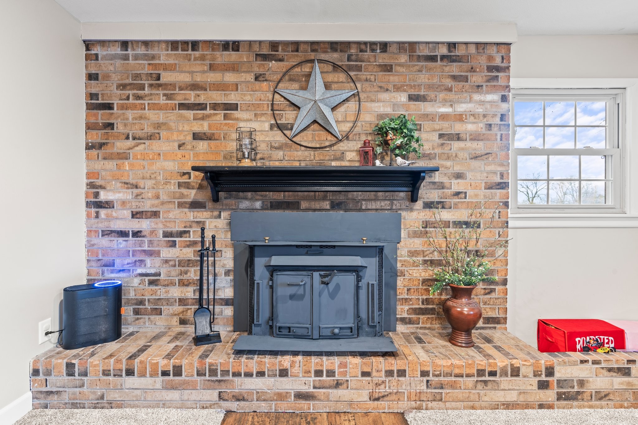 759 Little Hurricane Road Winchester, TN 37398 - Photo 7 of 30 a fireplace with a potted plant on it