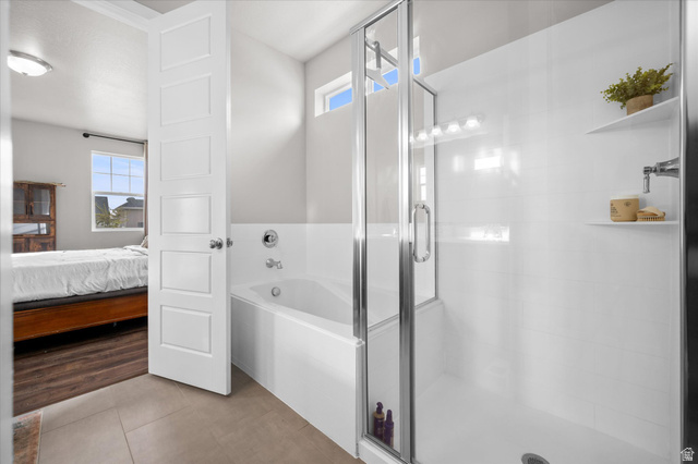 3359 Eurasian Crane Road Clinton, UT 84015 - Photo 22 of 71 Ensuite bathroom with a bath, a stall shower, and tile patterned floors
