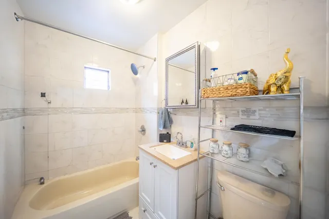 a bathroom with a bathtub and a sink