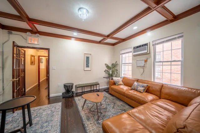 a living room with furniture and a window