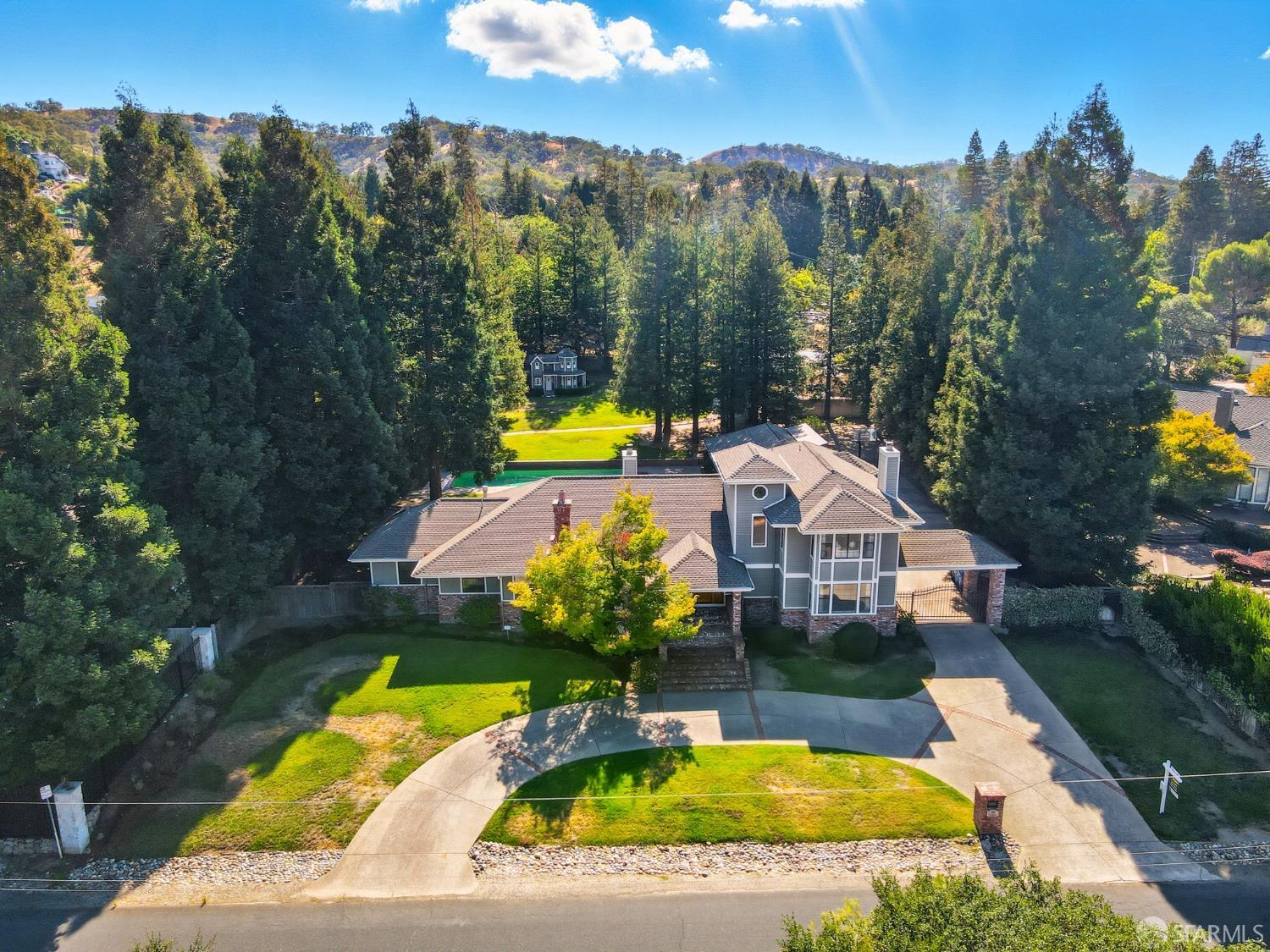 165 Pine Creek Road Walnut Creek, CA 94598 - Photo 1 of 79 an aerial view of a house with swimming pool patio and outdoor seating