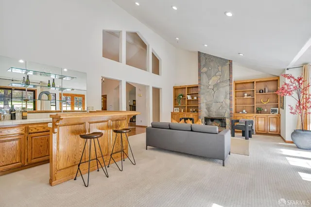 a dining room with furniture window and wooden floor