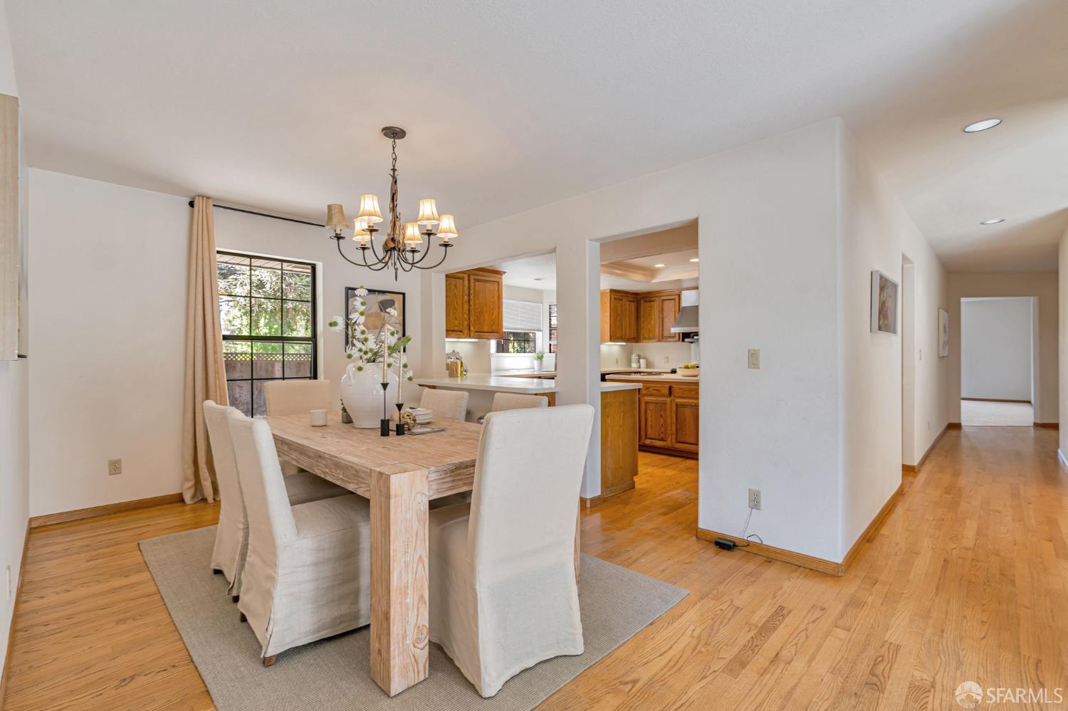165 Pine Creek Road Walnut Creek, CA 94598 - Photo 30 of 79 a view of a dining room with furniture window and wooden floor