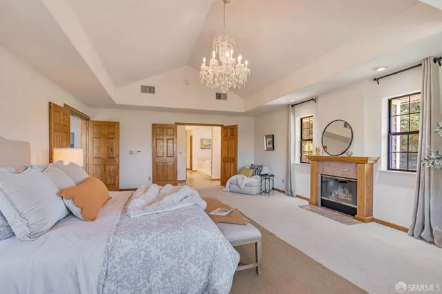 a bathroom with a tub a sink and a large window