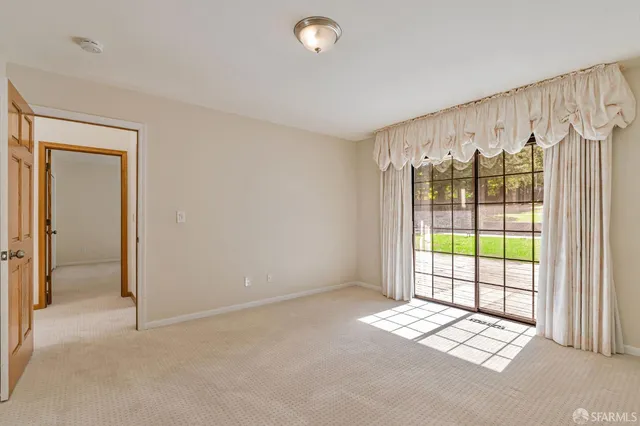 a view of a house with swimming pool and sitting area