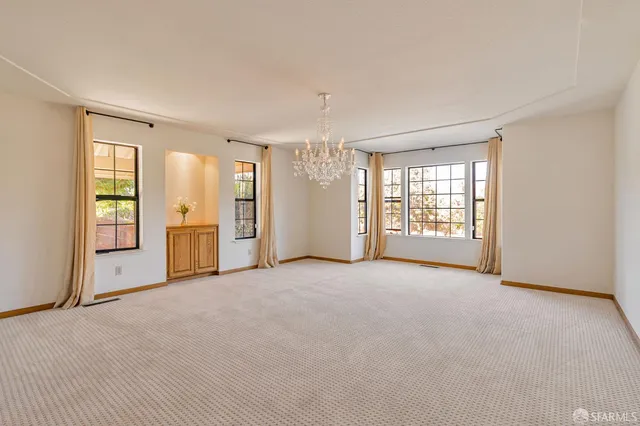 a view of a swimming pool with an outdoor space and seating area