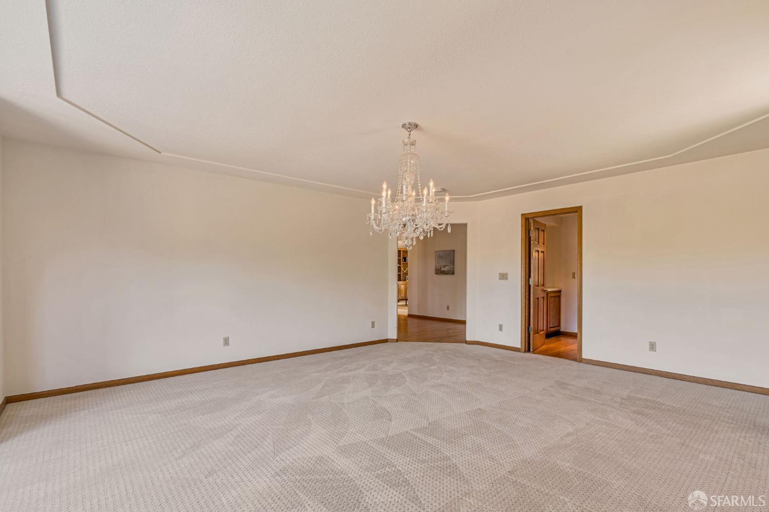 165 Pine Creek Road Walnut Creek, CA 94598 - Photo 47 of 79 wooden floor in an empty room with a chandelier