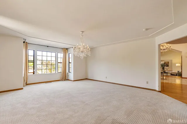 a view of a house with a sink and wooden floor