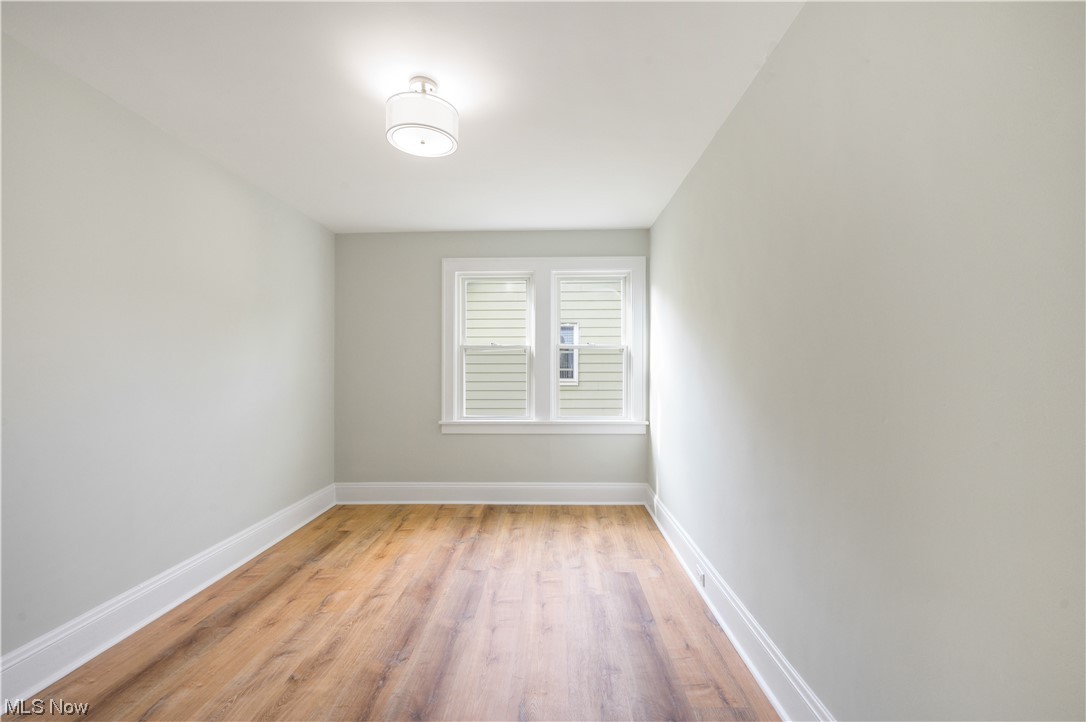 1606 Maple Road Cleveland Heights, OH 44121 - Photo 19 of 30 The 2nd floor offers 3 spacious bedrooms and newly updated full bathroom(2023) features bathtub, sliding shower doors, double sink vanity.