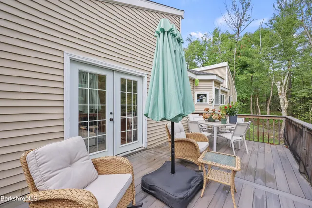 a living room with furniture and a ceiling fan