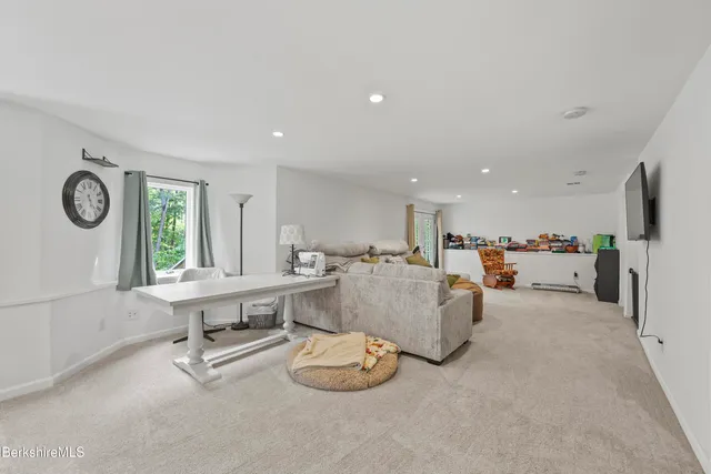 a view of a backyard with wooden floor and floor to ceiling window