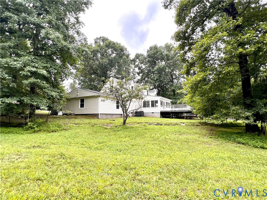 2049 Riddle Road Blackstone, VA 23824 - Photo 5 of 41 a front view of a house with a yard garage and trees
