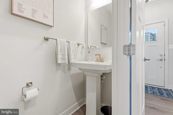 a bathroom with a sink and mirror