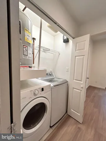a kitchen with kitchen island granite countertop a sink stainless steel appliances and cabinets