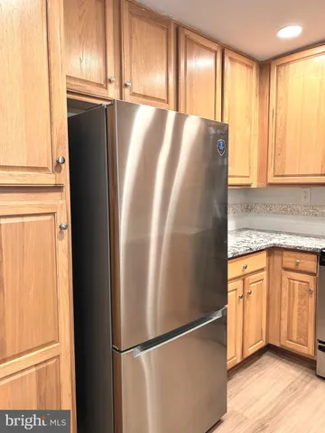 a kitchen with sink a microwave and cabinets