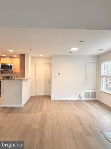 a view of a kitchen with a sink and a stove top oven