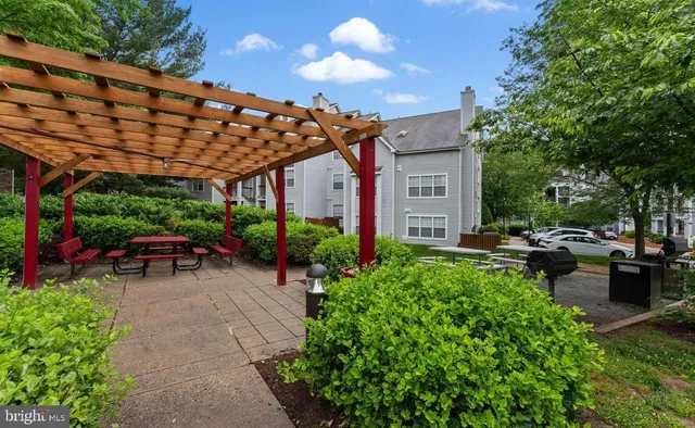 a view of a backyard with sitting area