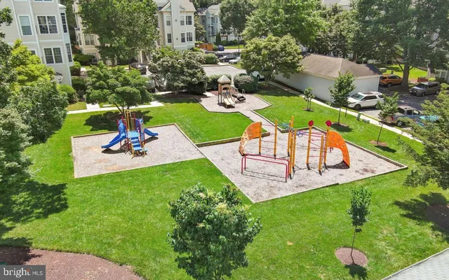 a view of a entryway of a house with a large window and plants