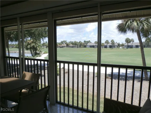 a view of a chair and table in the porch