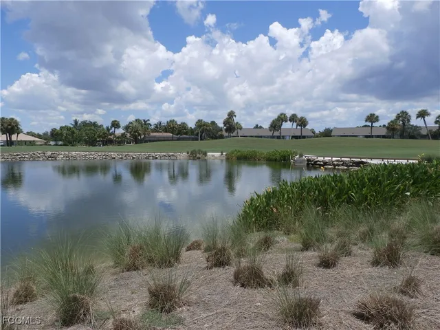 an aerial view of lake residential house with outdoor space and trees