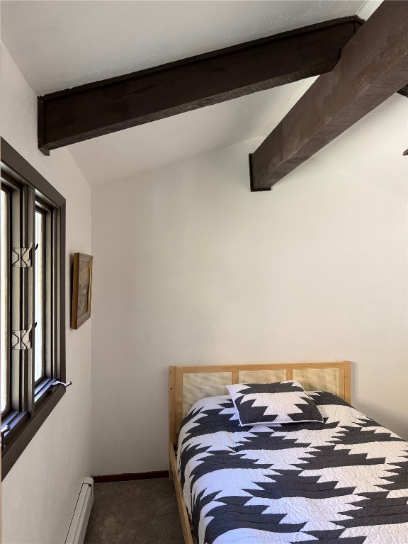 2099 Chamonix Lane, Unit 1A Vail, CO 81657 - Photo 13 of 29 a bedroom with a bed and dresser