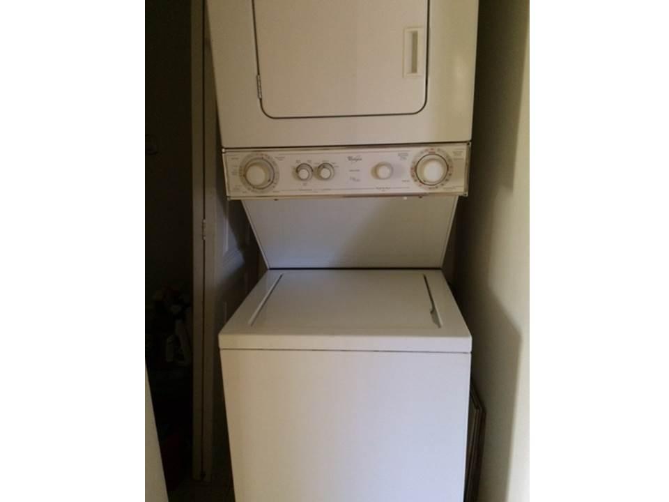 4328 Woodstock Drive, Unit D West Palm Beach, FL 33409 - Photo 9 of 9 a utility room with dryer and washer