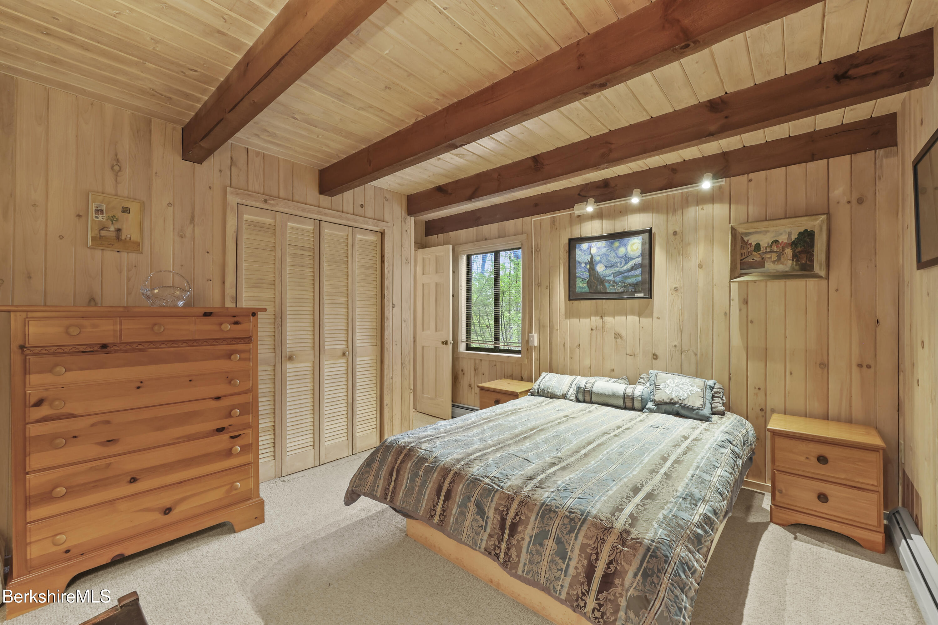 422 Bonny Rigg Hill Road Becket, MA 01223 - Photo 23 of 60 a bedroom with a bed and a dresser