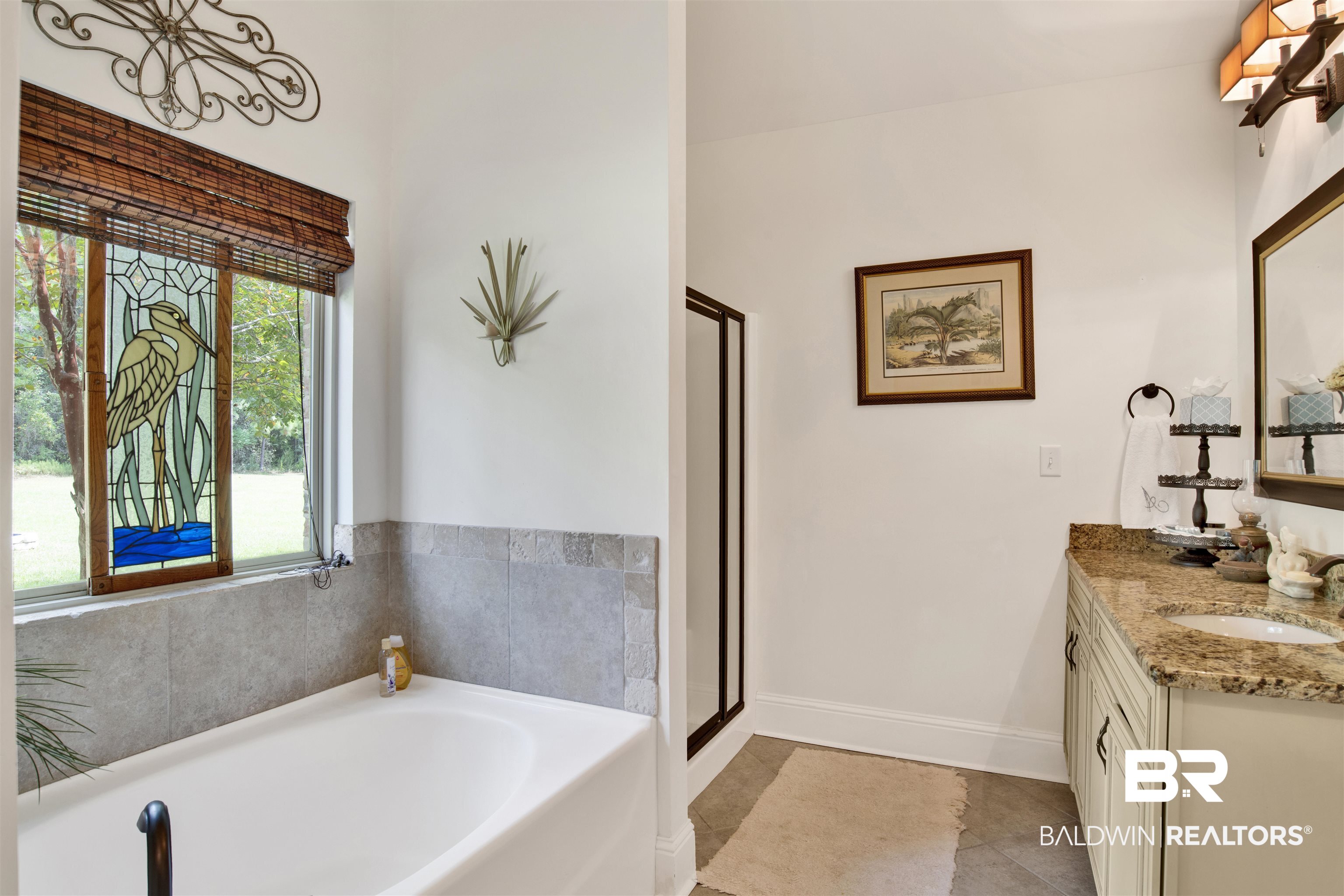 9240 Bay Point Drive Elberta, AL 36530 - Photo 18 of 22 Bathroom with vanity, separate shower and tub, and tile patterned floors