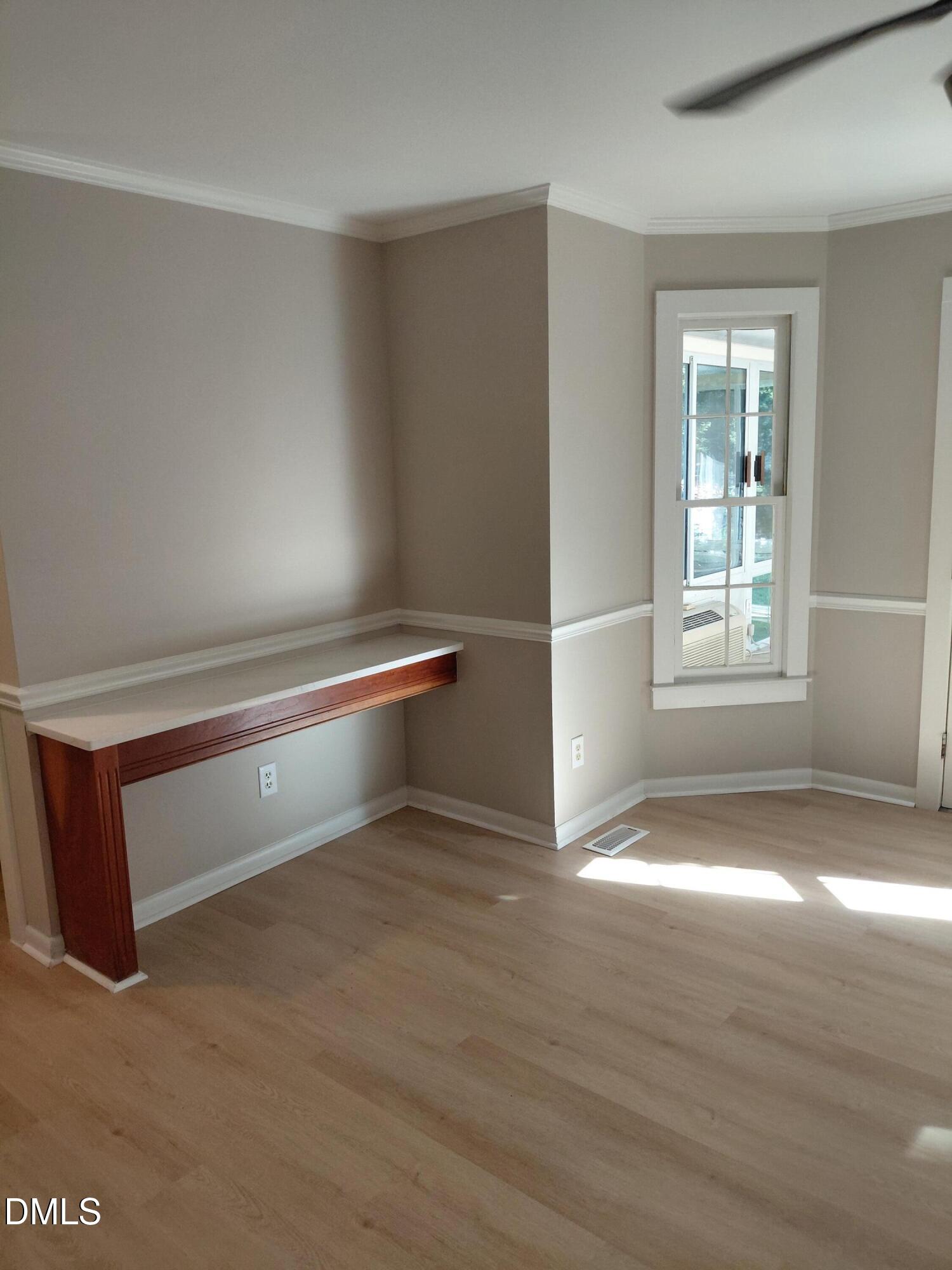 804 Olive Street Apex, NC 27502 - Photo 28 of 60 a view of wooden floor and windows in a room