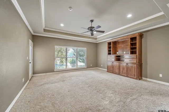 a view of a kitchen with a stove cabinets and a ceiling fan