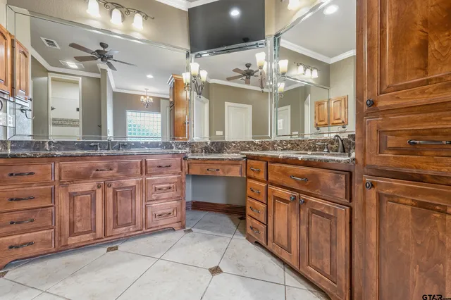 a large bathroom with a sink and a large mirror