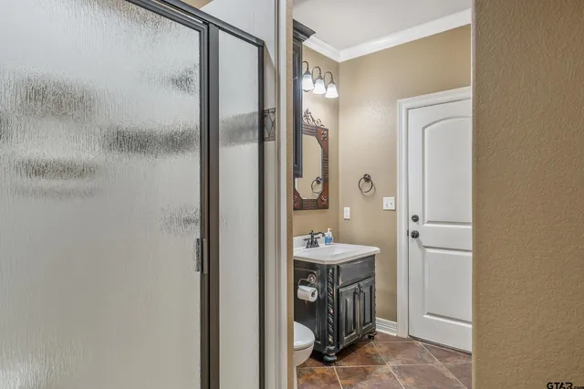a bathroom with a sink a mirror and a shower