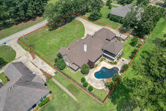 an aerial view of residential house with outdoor space