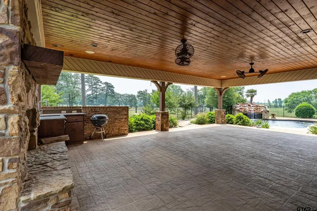 an aerial view of a house with outdoor space