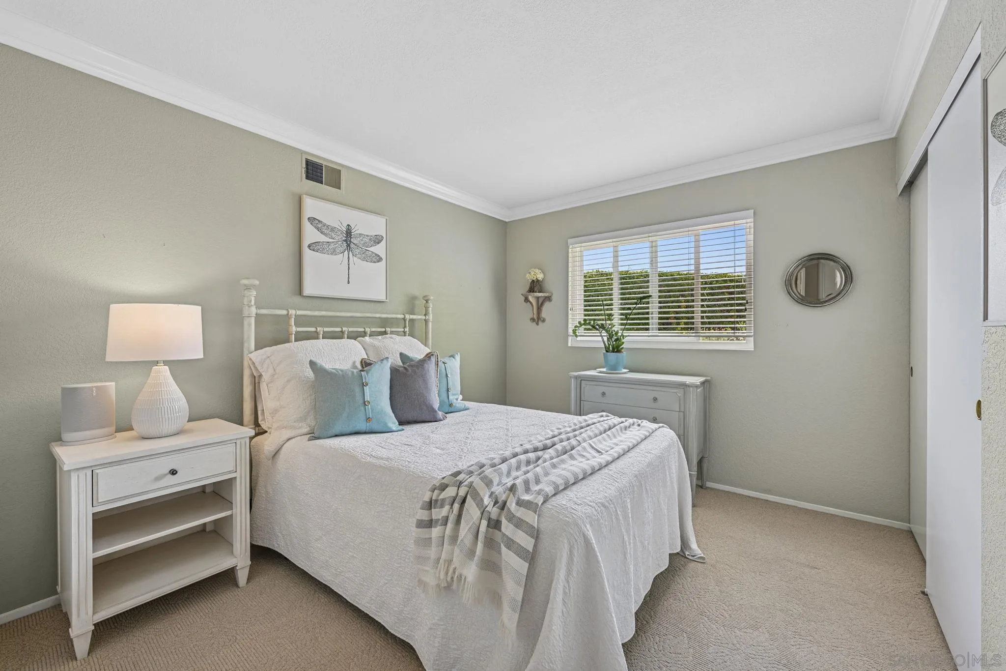 602 Hollyridge Drive Encinitas, CA 92024 - Photo 23 of 50 a bedroom with a bed and a window