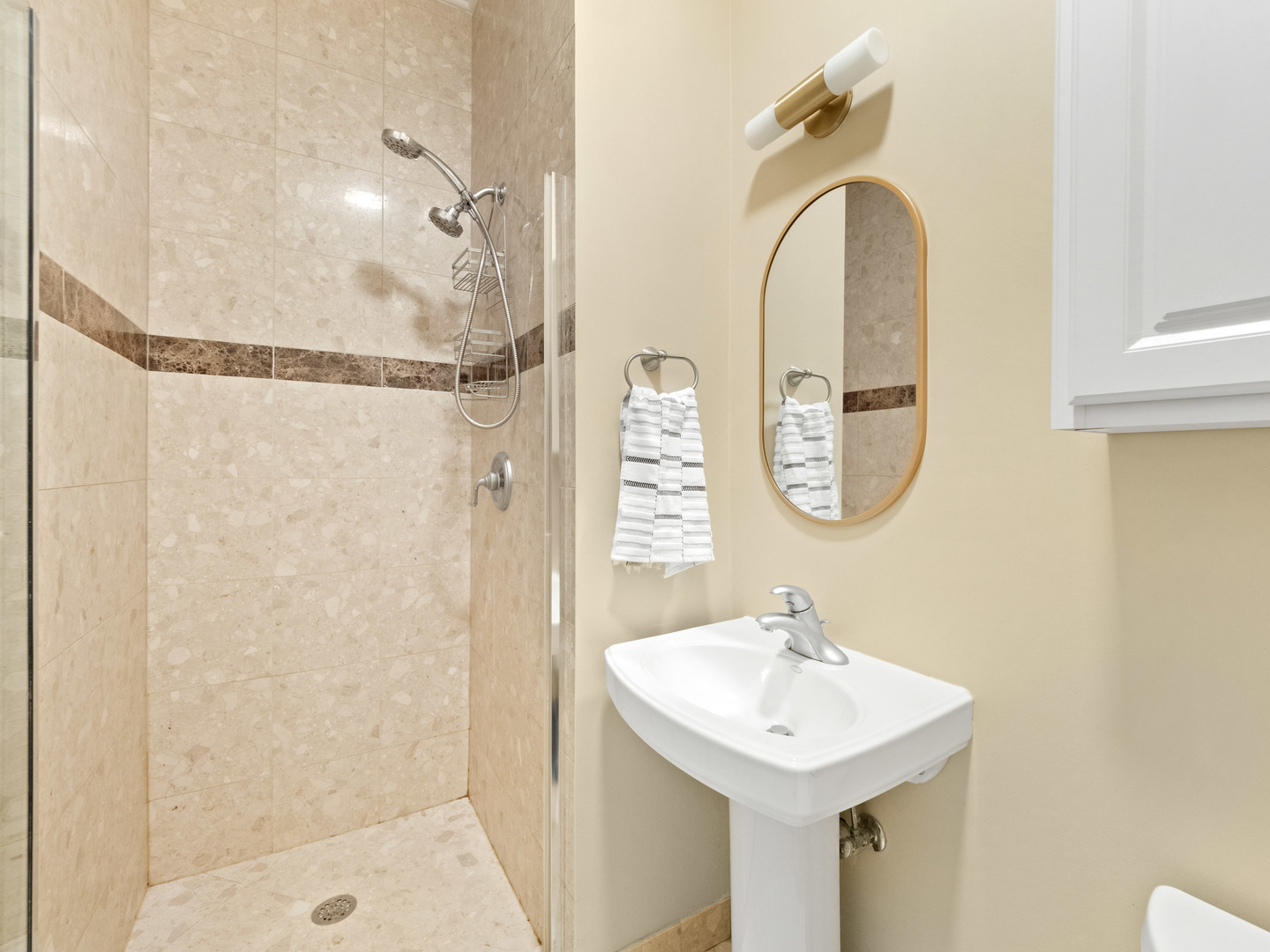 838 North Greenview Avenue, Unit 3 Chicago, IL 60642 - Photo 15 of 18 a bathroom with a sink a mirror a vanity and a shower