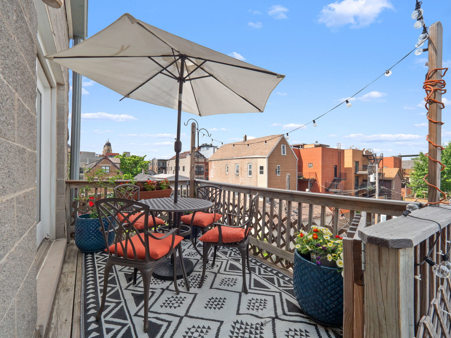 838 North Greenview Avenue, Unit 3 Chicago, IL 60642 - Photo 17 of 18 an outdoor sitting area with furniture and umbrella