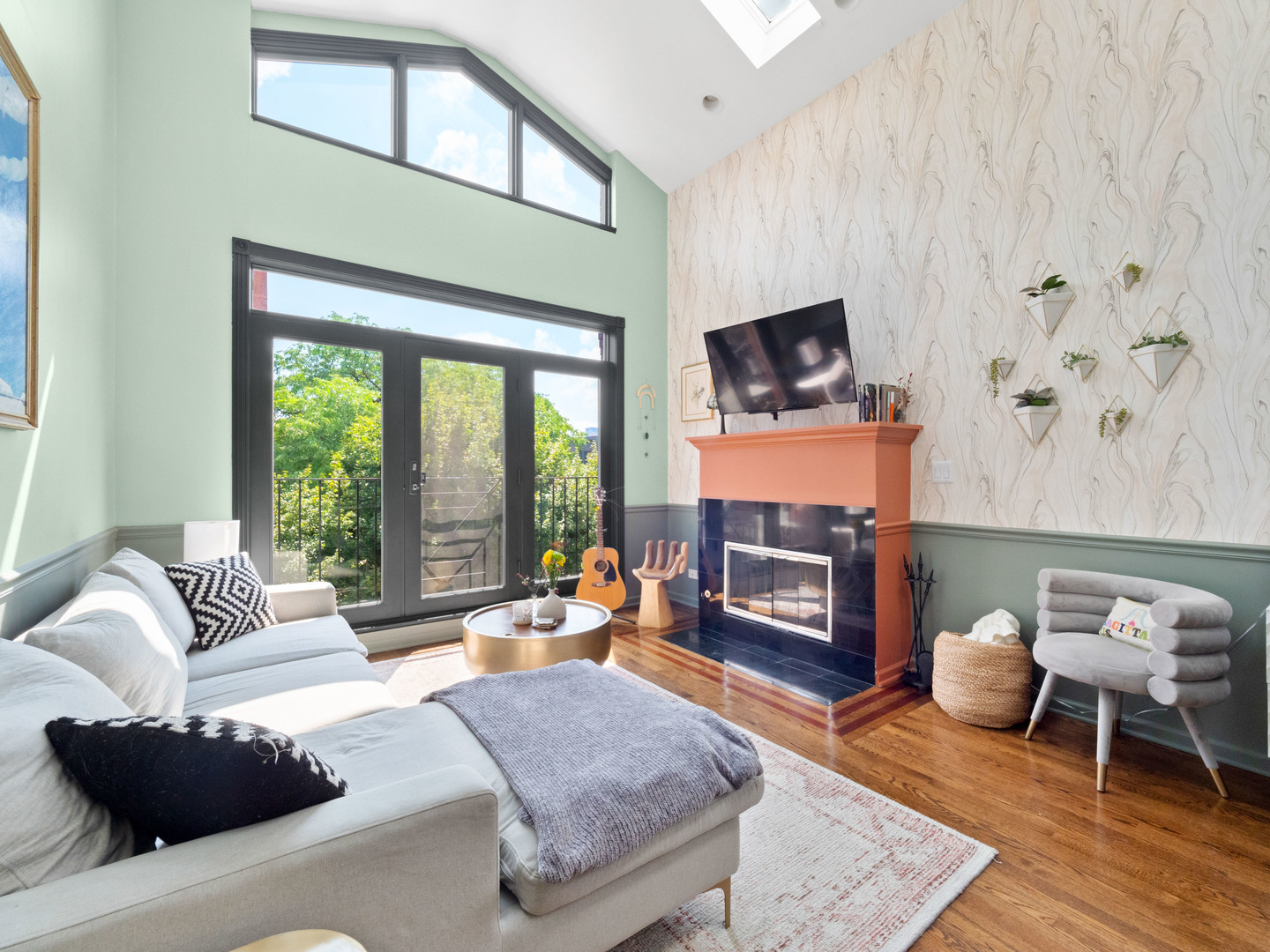 838 North Greenview Avenue, Unit 3 Chicago, IL 60642 - Photo 3 of 18 a living room with furniture a fireplace and a floor to ceiling window